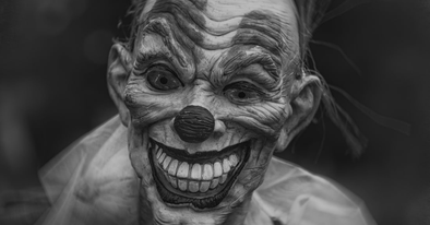 terrifying grinning clown face